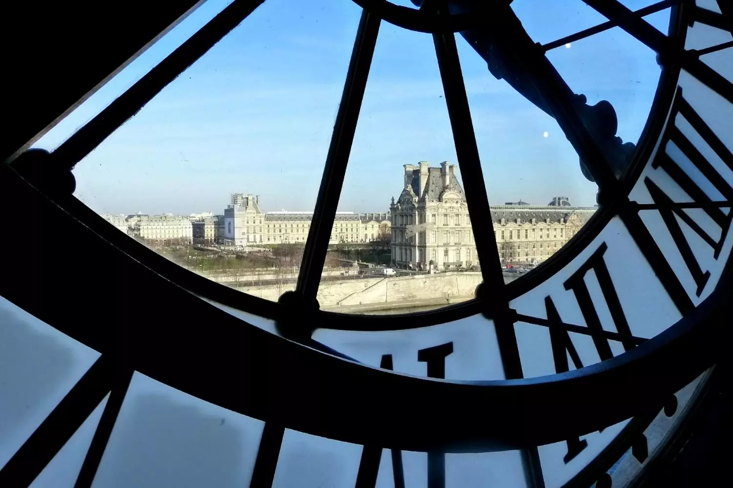 View of the Seine and the Louvre through the glass clock of the Musée d'Orsay